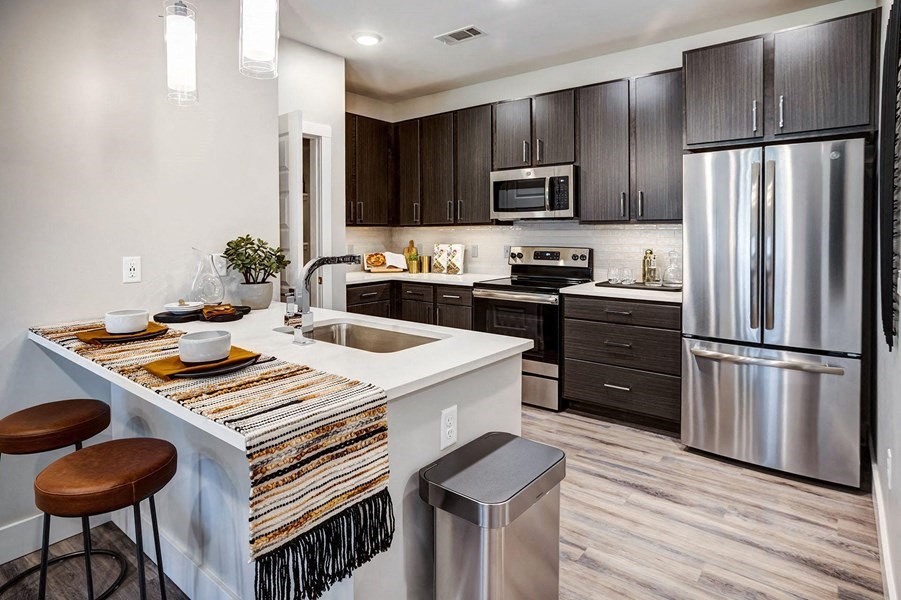Kitchen and dining Kitchen and dining at Icon Apartment Homes at Ferguson Farm, Montana, 59718