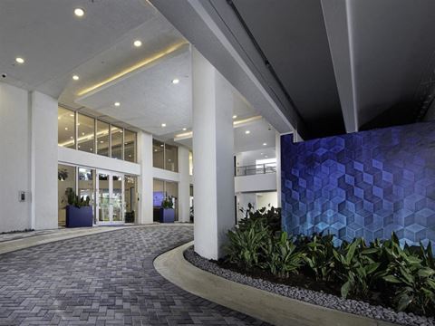 a large blue tile wall in the lobby of an office building at Saba Pompano Beach, Pompano Beach, FL