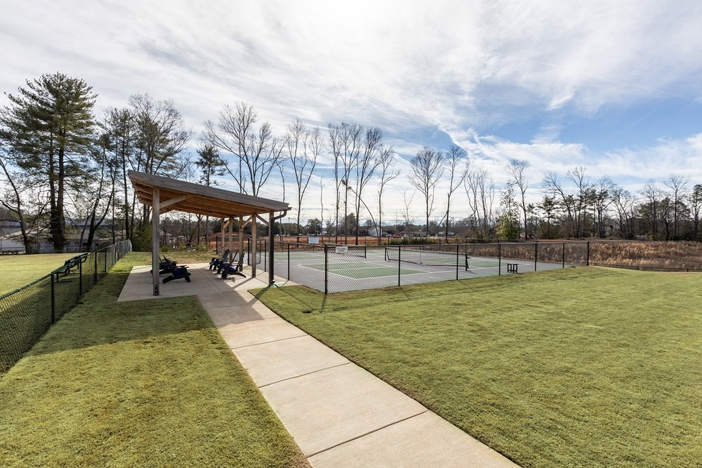 the pavilion overlooking the tennis courts at the whispering winds apartments in pearland