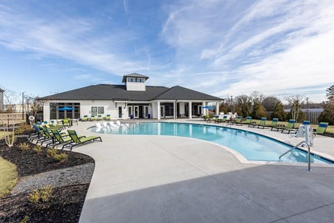 the preserve at ballantyne commons pool and club house with a resort style pool