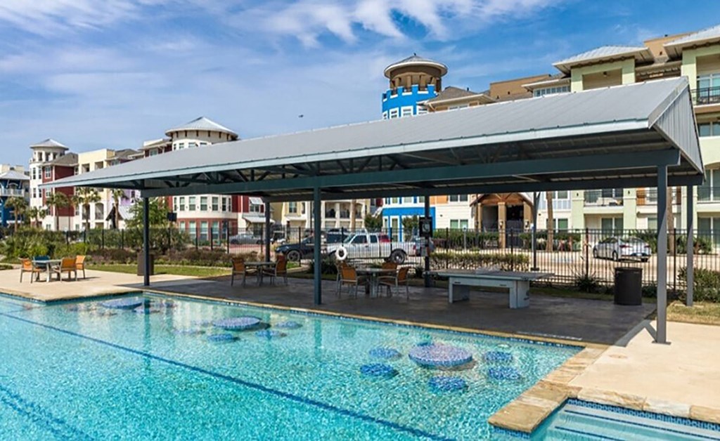 a swimming pool with a canopy over it