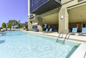 pool with sundeck with chairs
