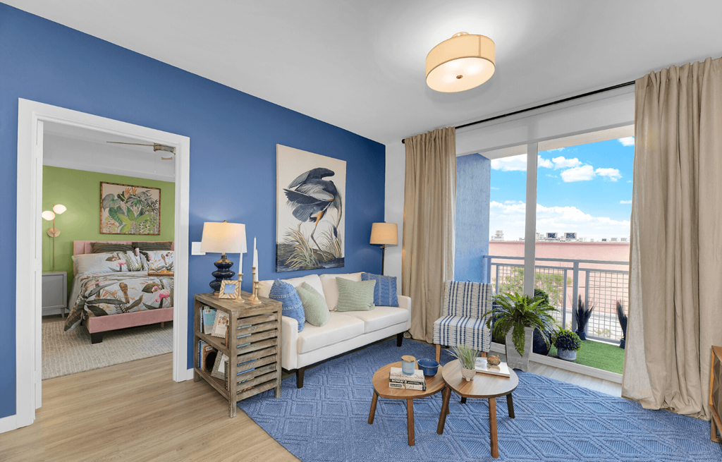 a living room with blue walls and a white couch