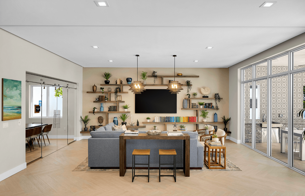 a living room with a couch and a table with chairs