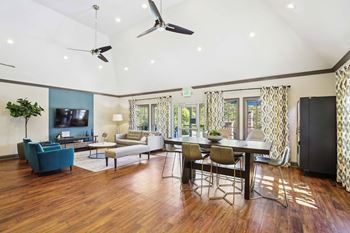 A living room with a blue couch and a television.
