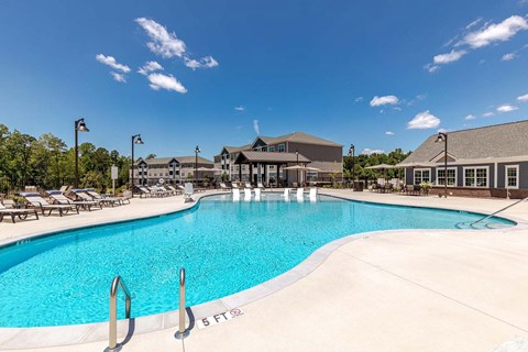 A large swimming pool with a 5 feet marking on the side.