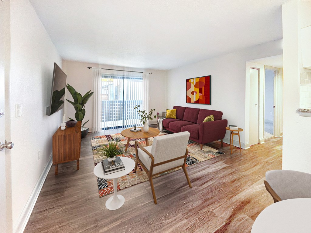 a living room with a couch and a chair and a table