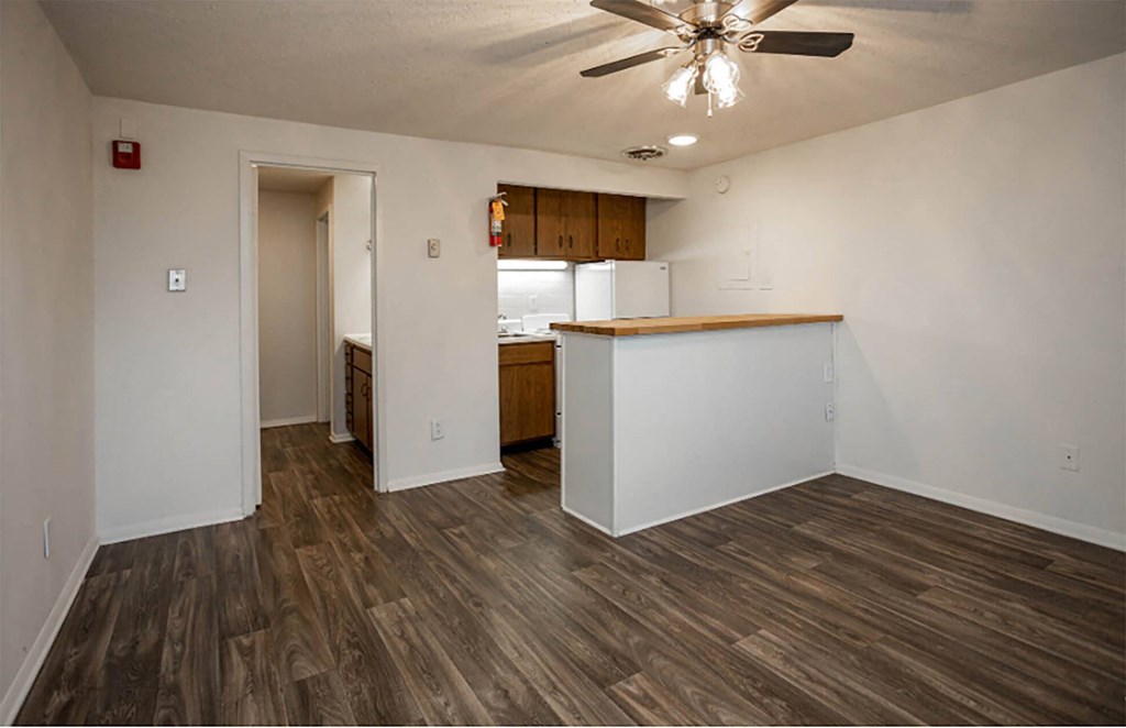 a kitchen and living room in a 555 waverly unit
