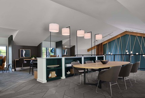 a dining room with a table and chairs