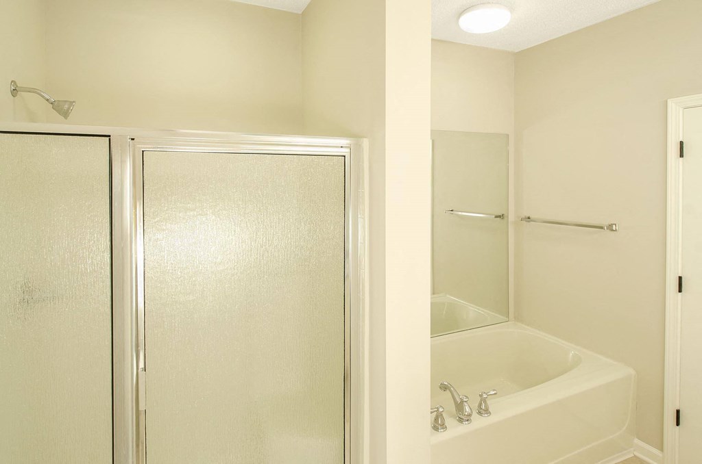 bathroom with garden tub and shower