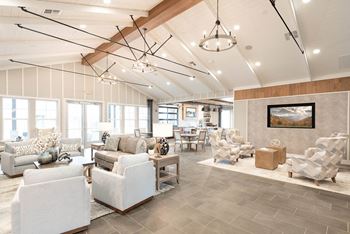 Clubroom with seating areas, computer workspaces, fireplace, and coffee bar and refreshments