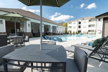 Sparkling swimming pool with in-pool tanning ledges and two designated swimming lanes