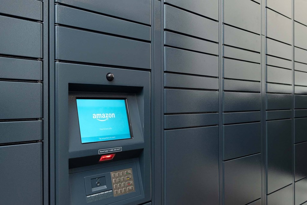 An Amazon vending machine is on a wall.