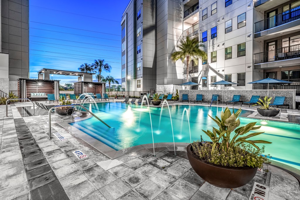 a swimming pool with a building in the background