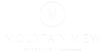 A logo with the letters "M" and "W" in a circular design.