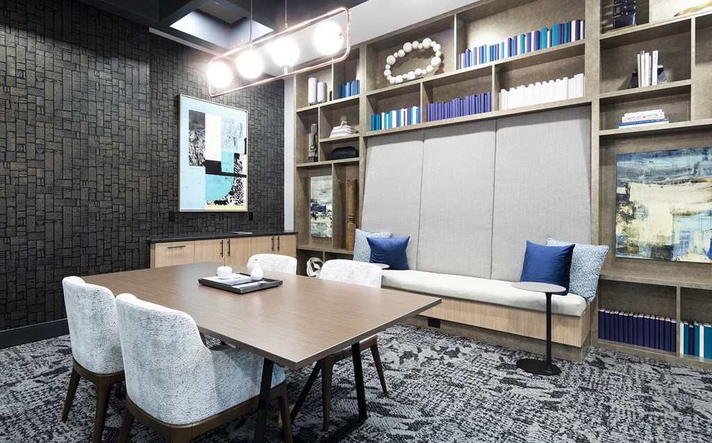 a conference room with a table and chairs