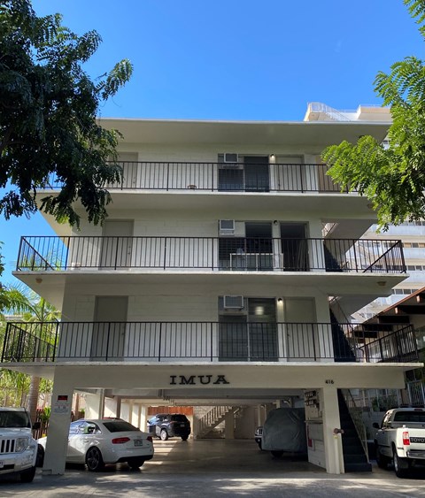 A white building with the word IMUA on the bottom.