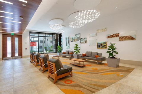 A modern living room with a long wooden sofa and a rug on the floor.