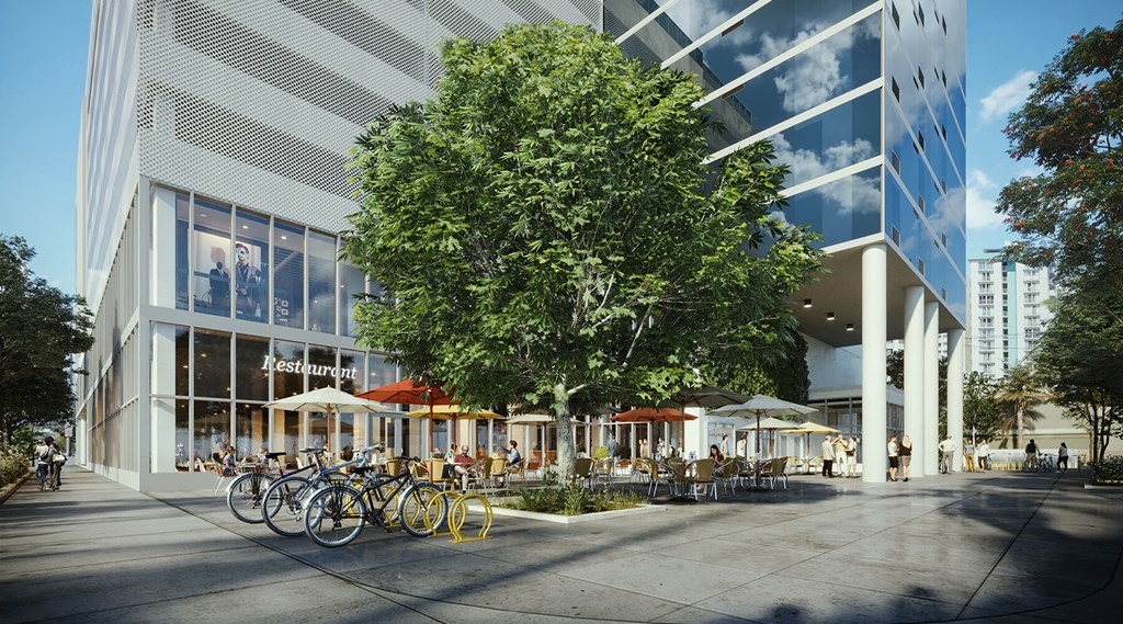a rendering of a building with bikes parked outside of it