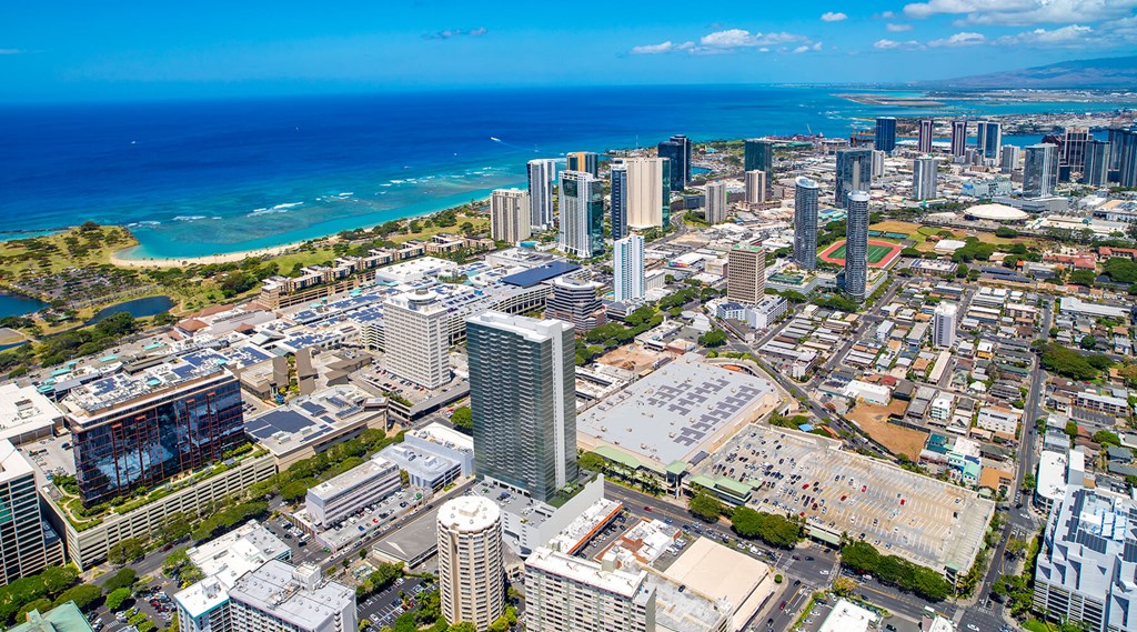 an aerial view of the city and the ocean