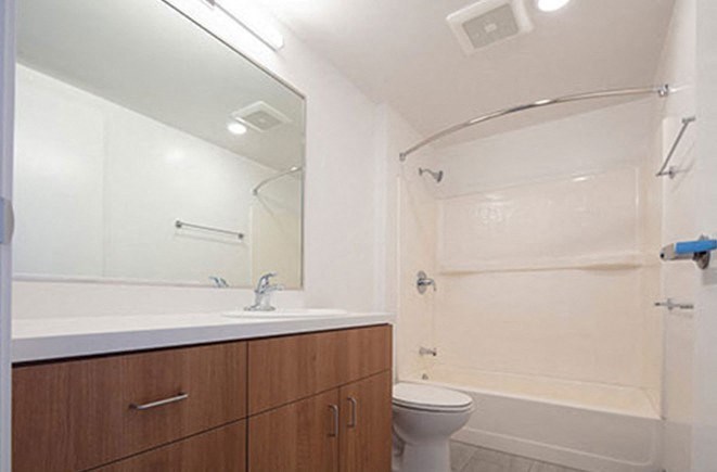 a bathroom with a sink toilet and a shower