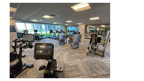 a room filled with lots of different types of exercise equipment