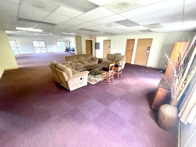 an empty room with couches chairs and a table