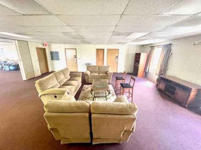 a living room filled with furniture and a fire place
