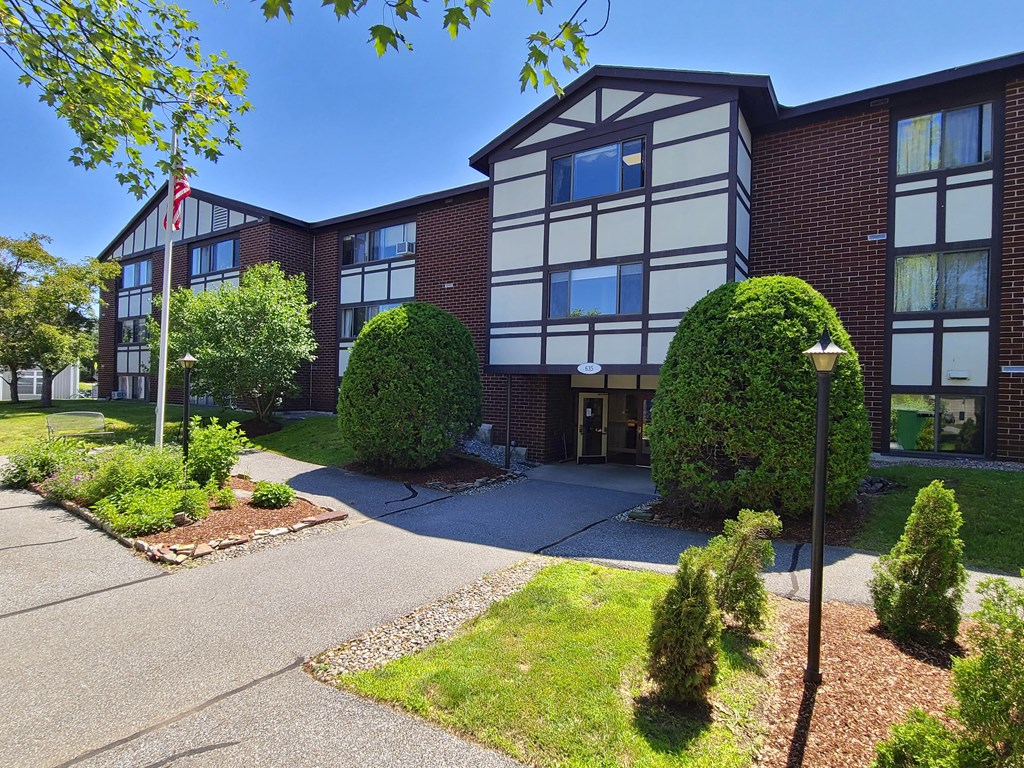 Exterior of the tudor style Country Park apartment building