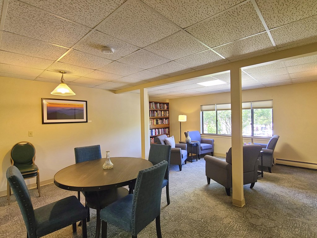 Country Park second floor lounge with seating and a bookcase