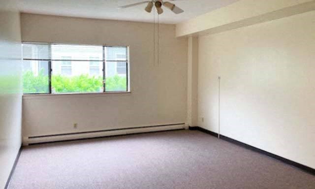 Country Park living room with carpeted floors and exterior window