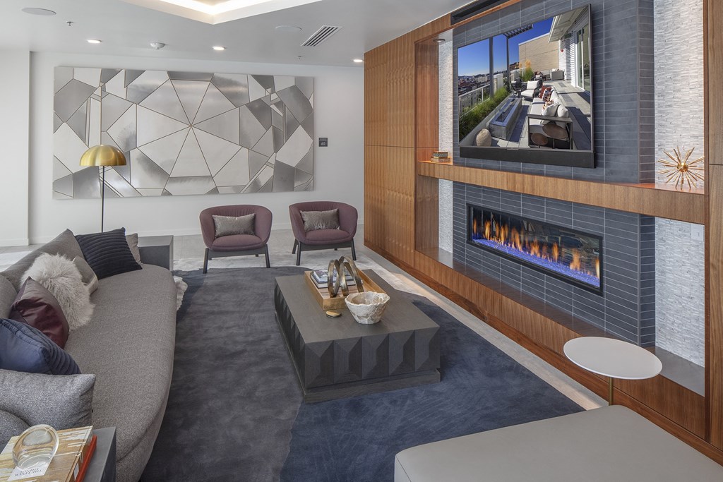 a living room with a couch and a fireplace