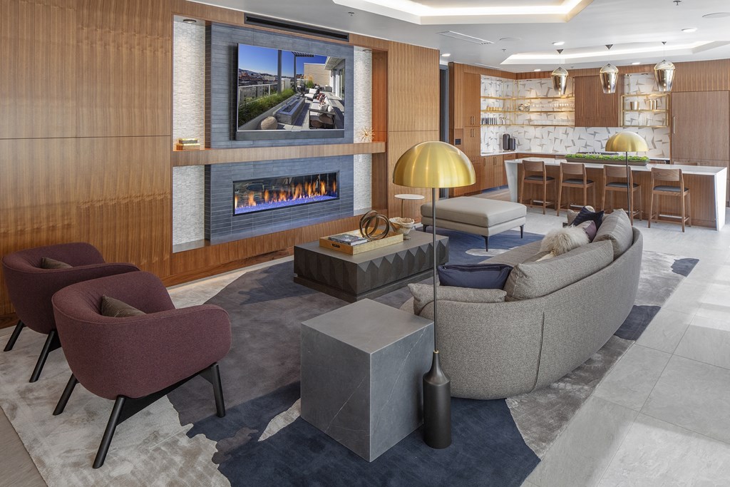 a living room filled with furniture and a fireplace