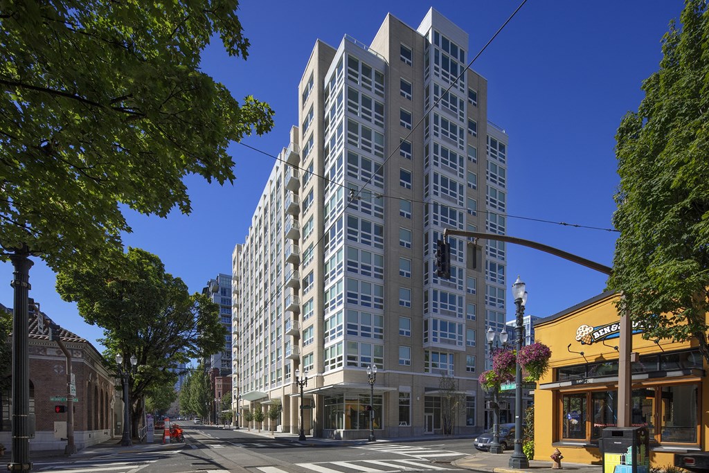 a tall apartment building on a city street