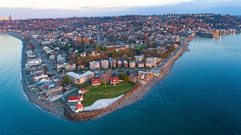 A small island with a town surrounded by water.