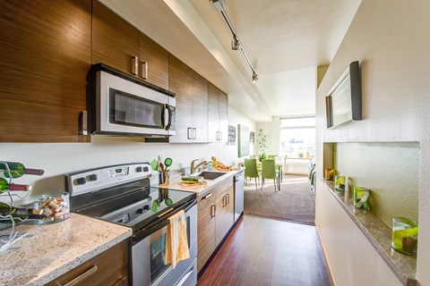 A kitchen with a microwave and oven on the counter.