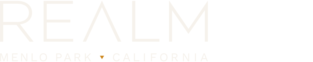 The image shows a logo with the word "REALM" in large letters, followed by "MENLO PARK CALIFORNIA" in smaller text.