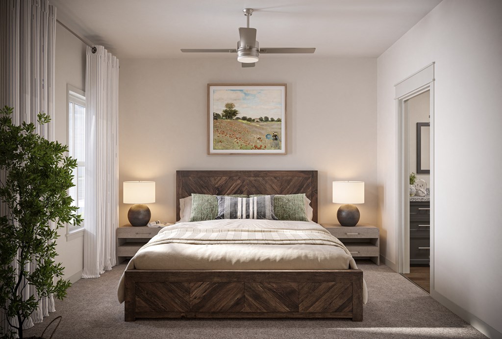 a bedroom with a bed and a ceiling fan at Allier Port Wentworth Apartments, Georgia, 31407