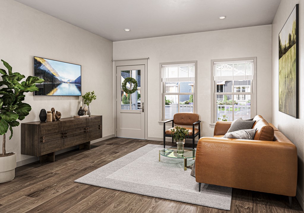 a living room with a couch and a table at Allier Port Wentworth Apartments, Georgia