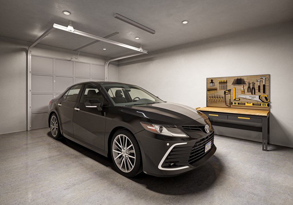 A black Lexus is parked in a garage with a painting on the wall. at Allier Foley, Foley, AL 36535