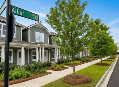 A street sign for Allier Blvd 200 is shown in front of a row of houses.