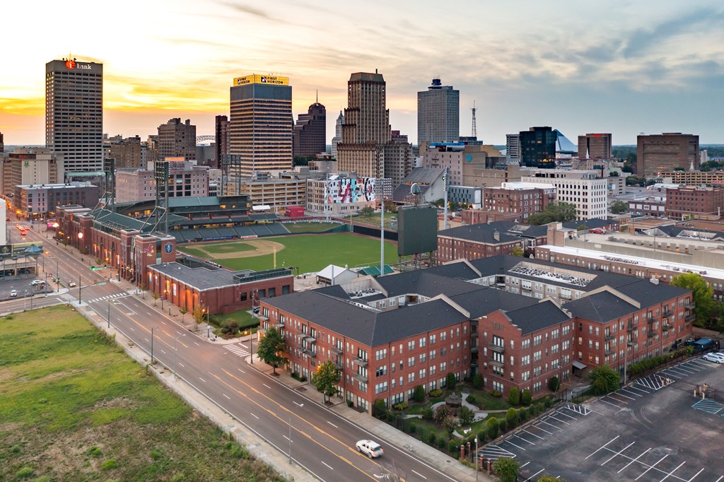 an aerial view of the city at sunset