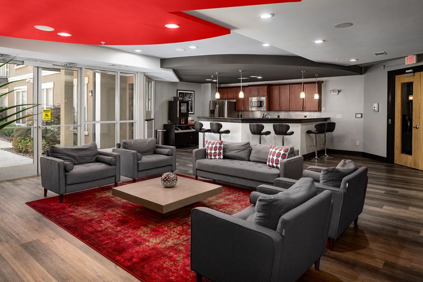 a living room with couches and chairs and a table