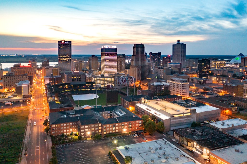 an aerial view of the city at dusk