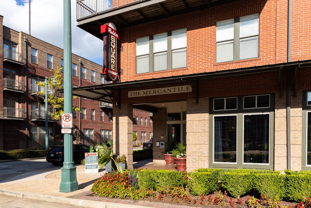 a brick building with a sign that reads the mercantile