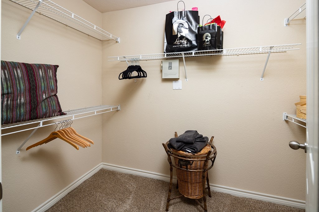 the walk in closet at the village apartments
