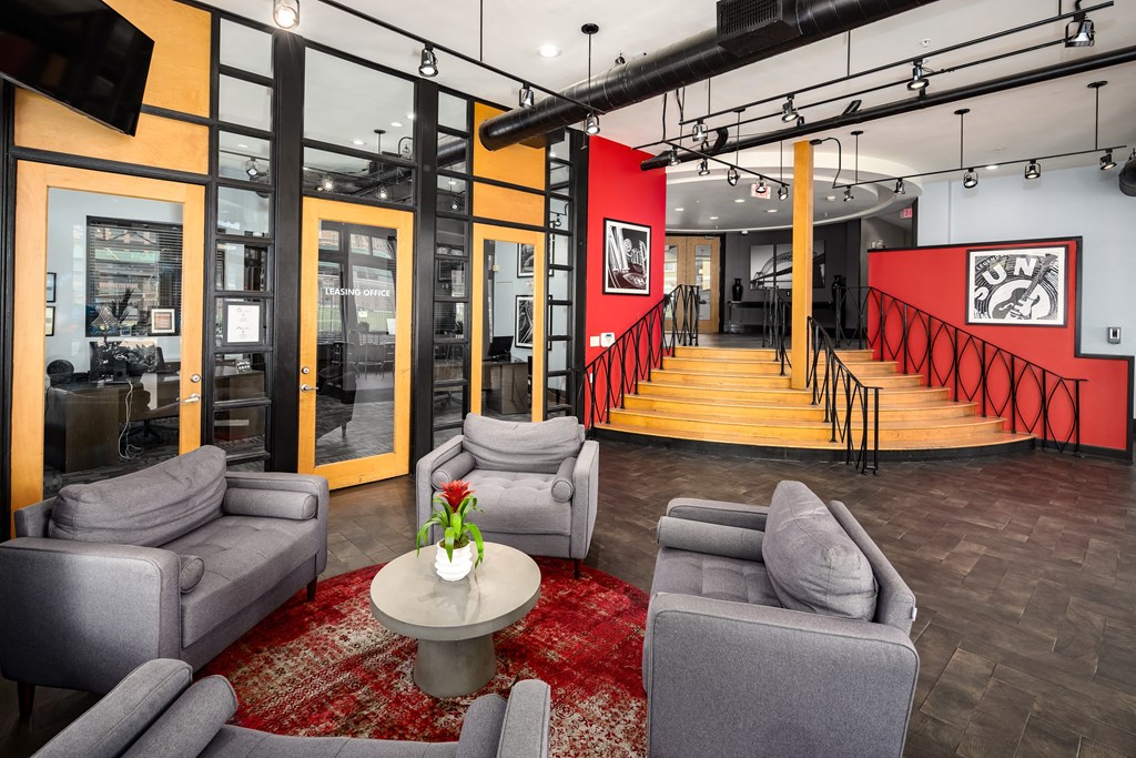 a lobby with couches and chairs and a table