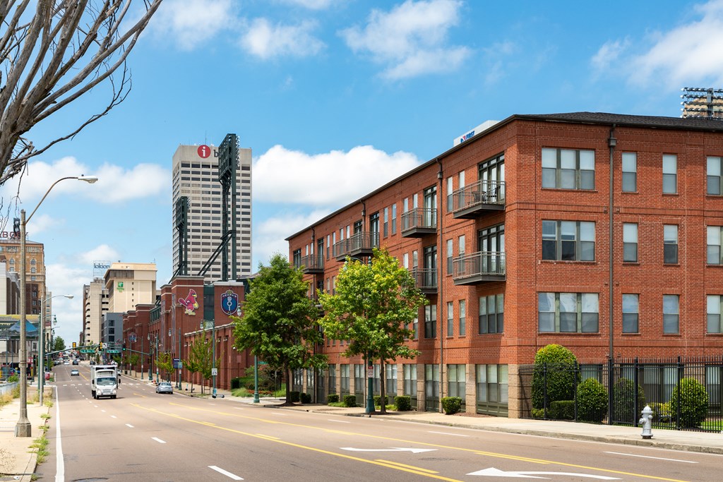 a large red brick building on a city street