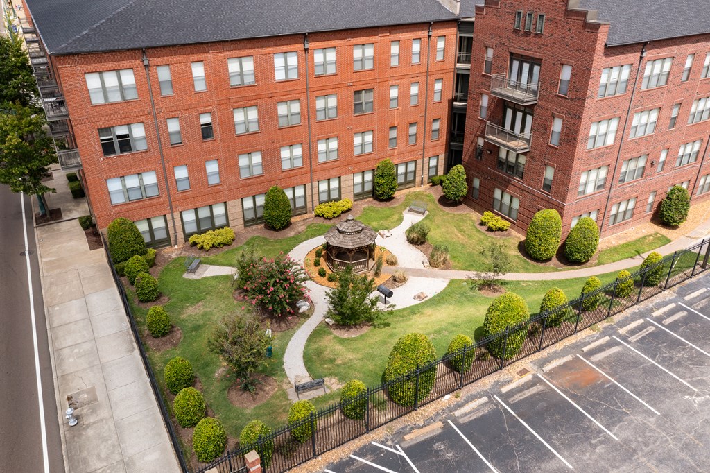 an aerial view of the courtyard of a building with a fountain