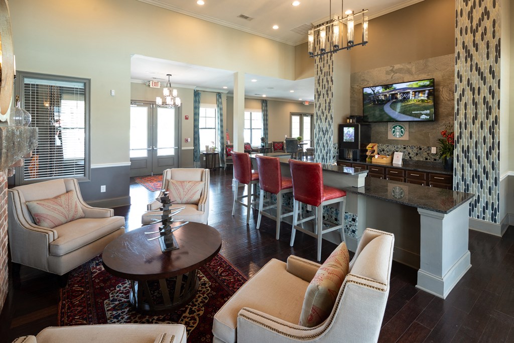 a living room with a bar and a dining room